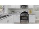 This remodeled kitchen has stainless steel appliances, granite counters, and white cabinets at 2480 Miriam Ln, Decatur, GA 30032