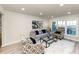 Inviting living room with neutral tones, plush seating, and natural light at 2480 Miriam Ln, Decatur, GA 30032