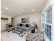Bright living room featuring large windows, recessed lighting, hardwood floors and modern decor at 2480 Miriam Ln, Decatur, GA 30032