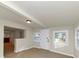Bright living room featuring light walls, tile floor, windows, and connecting room with bar at 2480 Miriam Ln, Decatur, GA 30032