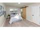 Bedroom featuring a barn door, natural light, and modern decorations for a cozy atmosphere at 2480 Miriam Ln, Decatur, GA 30032