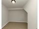 Room with light colored tile floor, neutral walls, and single light overhead at 2480 Miriam Ln, Decatur, GA 30032