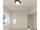 Bright room with neutral paint, modern lighting and window at 2480 Miriam Ln, Decatur, GA 30032