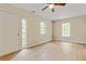 This bright bedroom features wood-look floors and two windows at 4639 Tell Sw Rd, Atlanta, GA 30331