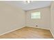 Bright bedroom featuring neutral walls and modern vinyl flooring at 4639 Tell Sw Rd, Atlanta, GA 30331