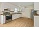 Renovated kitchen featuring stainless steel appliances and ample cabinet space at 4639 Tell Sw Rd, Atlanta, GA 30331