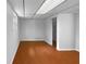 Basement featuring neutral walls and vinyl flooring; perfect for a home office or playroom at 6389 Cumberland Dr, Rex, GA 30273