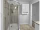 This bathroom includes a glass-enclosed shower with tile walls and a built-in shelving niche at 6389 Cumberland Dr, Rex, GA 30273