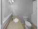 This bathroom includes a granite vanity top, built-in cabinet, and a standard toilet at 6389 Cumberland Dr, Rex, GA 30273