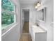 Bright bathroom with a window providing natural light over vanity at 6389 Cumberland Dr, Rex, GA 30273
