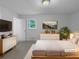 Serene bedroom with neutral walls, wood furniture, and comforting natural light at 6389 Cumberland Dr, Rex, GA 30273