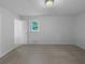 Spacious bedroom with neutral carpet, a window, and ample natural light at 6389 Cumberland Dr, Rex, GA 30273