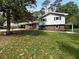Charming two-story home with a brick facade and a well-maintained lawn at 6389 Cumberland Dr, Rex, GA 30273