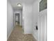 Bright entryway hallway with neutral paint and easy access to other rooms at 6389 Cumberland Dr, Rex, GA 30273