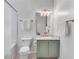 Bathroom featuring updated vanity, mirror, and tub with shower at 800 Peachtree Ne St # 101, Atlanta, GA 30308
