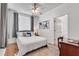 Bright bedroom with large window, ceiling fan, and desk area at 800 Peachtree Ne St # 101, Atlanta, GA 30308