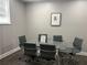 Modern conference room with a glass table, six chairs, and natural light at 800 Peachtree Ne St # 101, Atlanta, GA 30308