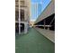 Community dog park with artificial turf and city views in the background at 800 Peachtree Ne St # 101, Atlanta, GA 30308