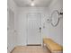 Inviting entryway with a bright interior, tiled floors, and a stylish mirror enhancing the welcoming atmosphere at 800 Peachtree Ne St # 101, Atlanta, GA 30308