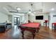 Bright game room with a red felt pool table, media center, and stylish seating at 800 Peachtree Ne St # 101, Atlanta, GA 30308