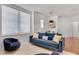 Cozy living room with natural light, plush seating, and a view into an adjacent dining area at 800 Peachtree Ne St # 101, Atlanta, GA 30308