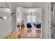 Open-concept living room featuring a cozy blue sofa, a large window, and modern decor accents at 800 Peachtree Ne St # 101, Atlanta, GA 30308