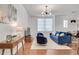 Bright living room features hardwood floors, stylish lighting, and comfortable seating at 800 Peachtree Ne St # 101, Atlanta, GA 30308