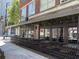 Outdoor seating and entryway to El Valle restaurant on a sidewalk at 800 Peachtree Ne St # 101, Atlanta, GA 30308