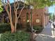 Charming restaurant exterior featuring brick facade and lush greenery at 800 Peachtree Ne St # 101, Atlanta, GA 30308
