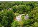 Breathtaking aerial view of the property nestled among lush trees in a serene neighborhood setting at 1327 Harvard Ne Rd, Atlanta, GA 30306