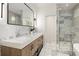 Elegant bathroom with double sinks, white countertops, marble floors, and a glass-enclosed shower at 1327 Harvard Ne Rd, Atlanta, GA 30306