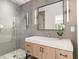 Bathroom featuring a glass shower, marble countertops, modern fixtures, and soft, neutral tones at 1327 Harvard Ne Rd, Atlanta, GA 30306