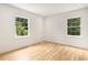 Sunlit bedroom with hardwood floors and large windows at 1327 Harvard Ne Rd, Atlanta, GA 30306