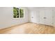 Bedroom with hardwood floors, two closet doors, and a bright window at 1327 Harvard Ne Rd, Atlanta, GA 30306