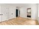 Bedroom with hardwood floors, recessed lighting, and a view into the attached bathroom at 1327 Harvard Ne Rd, Atlanta, GA 30306