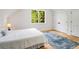 Comfortable bedroom with a cozy rug, closet, and hardwood flooring at 1327 Harvard Ne Rd, Atlanta, GA 30306
