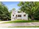 Charming front exterior with a well-manicured lawn and elegant entrance, surrounded by lush greenery and mature trees at 1327 Harvard Ne Rd, Atlanta, GA 30306