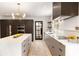 Modern kitchen with a large island, stainless steel appliances, and dark wood cabinets at 1327 Harvard Ne Rd, Atlanta, GA 30306