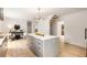 Spacious open kitchen with an island, modern lighting, stairs, and hardwood floors at 1327 Harvard Ne Rd, Atlanta, GA 30306