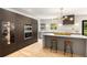 Modern kitchen featuring stainless steel appliances, a quartz island, and stylish bar stools at 1327 Harvard Ne Rd, Atlanta, GA 30306