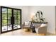 Bright living area with french doors leading to an outdoor balcony and a round mirror at 1327 Harvard Ne Rd, Atlanta, GA 30306