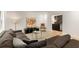Cozy living room with sectional couch, a decorative painting, and a small wet bar at 1327 Harvard Ne Rd, Atlanta, GA 30306