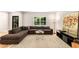 Spacious living room with ample seating, a round glass table, and a decorative painting at 1327 Harvard Ne Rd, Atlanta, GA 30306