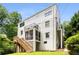 Stunning rear exterior featuring a screened-in porch, deck, balcony, and a beautifully landscaped yard at 1327 Harvard Ne Rd, Atlanta, GA 30306