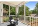 Screened porch with comfortable chair offering serene outdoor views of the home's surroundings at 1327 Harvard Ne Rd, Atlanta, GA 30306