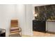 Charming wet bar with black floral wallpaper, black cabinets, and gold accents at 1327 Harvard Ne Rd, Atlanta, GA 30306