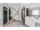 Large bathroom with double vanities, soaking tub, and separate shower in neutral tones at 1604 Summersweet Ln, Dacula, GA 30019