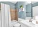 Bathroom features a shower-tub combo, vanity, and modern fixtures at 1604 Summersweet Ln, Dacula, GA 30019