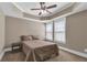 Bedroom featuring neutral walls, carpet floors, a ceiling fan, and natural light from the two windows at 1604 Summersweet Ln, Dacula, GA 30019