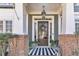 Elegant entryway featuring a striped rug, hanging lantern, and a door with glass panels at 1604 Summersweet Ln, Dacula, GA 30019